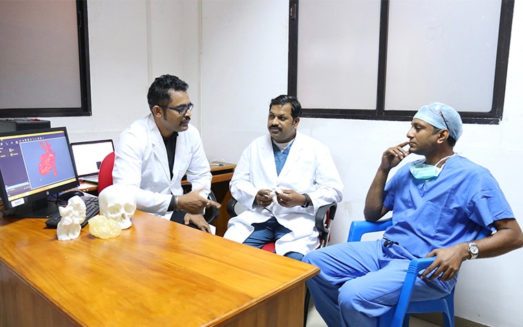 AIMS team discussing a case in an office 