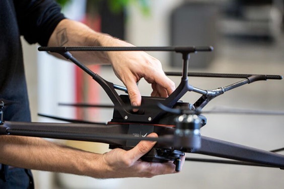 A person holds a finished Avular drone