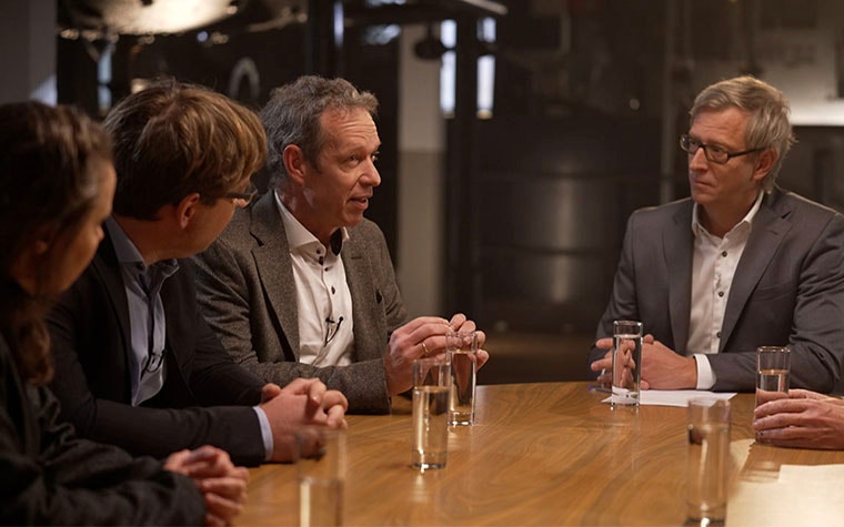 Group of Materialise innovators sitting around a table
