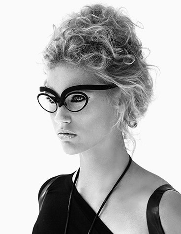 Gray-scale image of a model looking off camera, wearing Hoet Cabrio SX eyewear