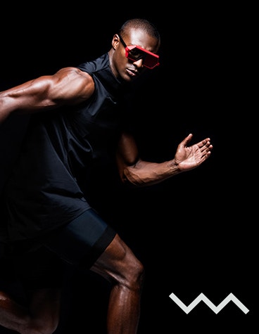 Black male model in a running position wearing sunglasses from the Vava Red Label collection