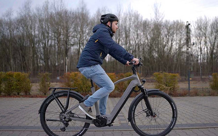 Person riding the Kalkhoff bike on the street