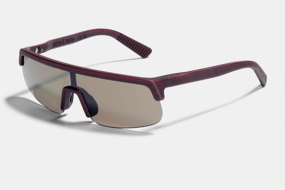 Angled product image of Ace & Tate Homerun Quinn sunglasses in Red Sun on a white platform