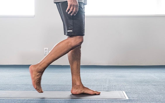 Person walking on a foot scanner