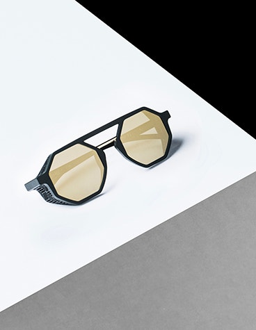 Top view of DA27 x Lasnik eyewear on a white surface