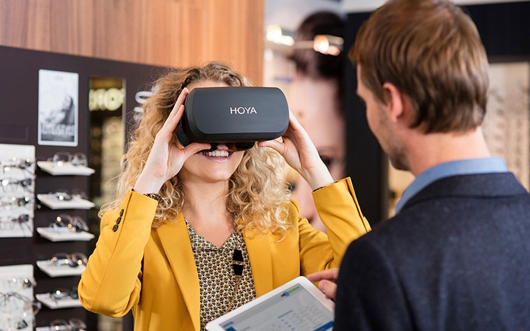 Woman using the HOYA vision simulator 