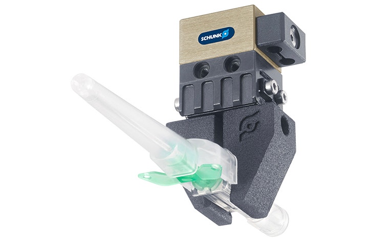 SCHUNK metal 3D-printed gripper lifting an item 