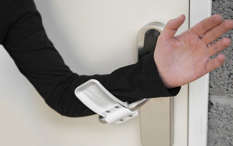 Person demonstrating the hands-free door opener