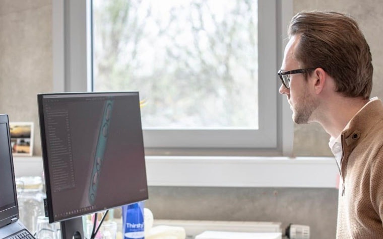 Man looking at medical software on his computer