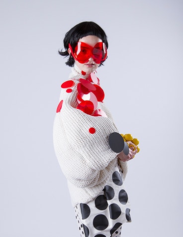 A woman wearing red Dávid Ring's 3D-printed luxury glasses