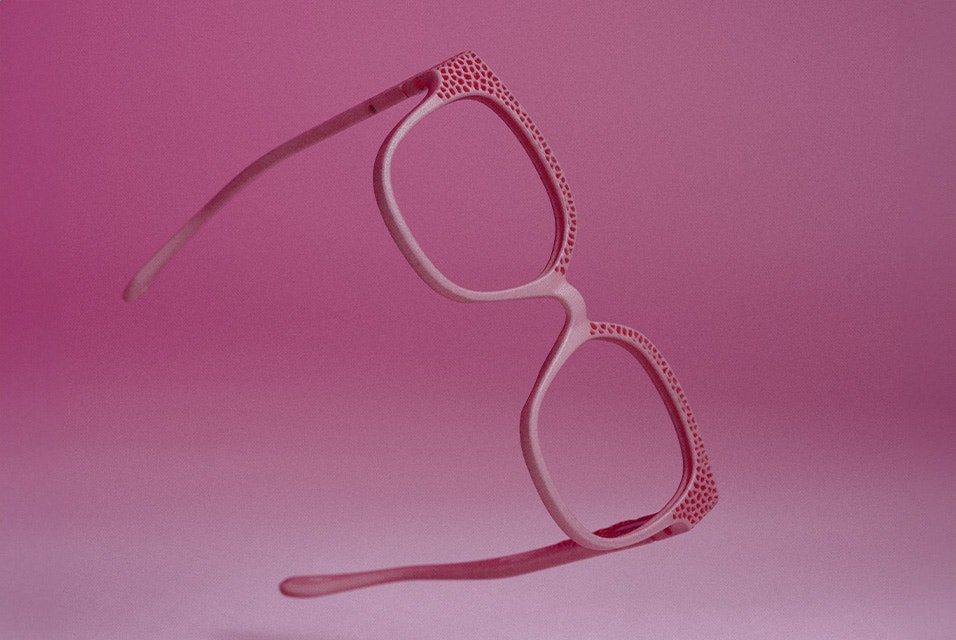 A pair of pink 3D-printed Acuitis frames against a pink background