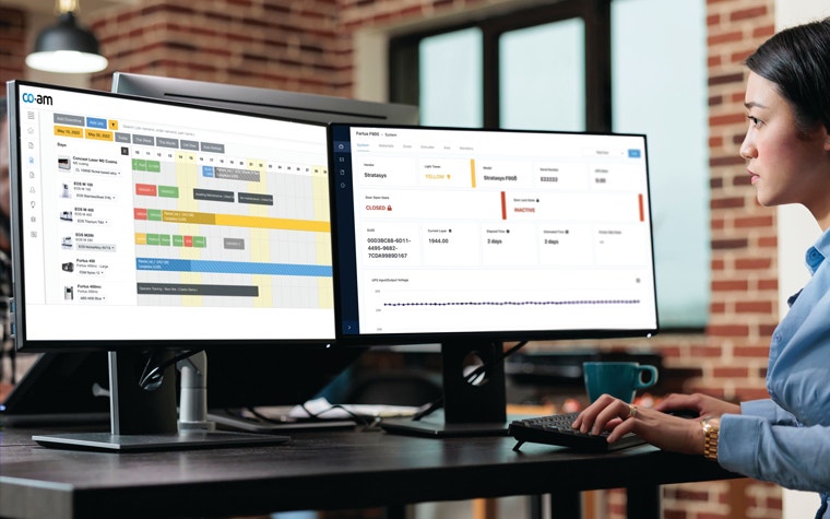 CO-AM Software Platform on two PC screens