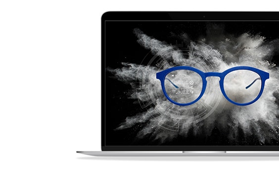 Blue 3D-printed smart glasses against a cloud of white powder on a black background.