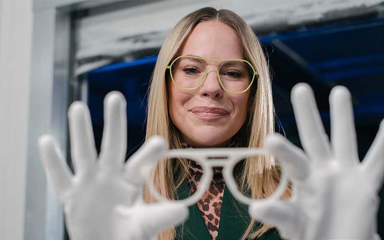 Eline de Munck, Founder of Odette Lunettes, holding a 3D-printed frame