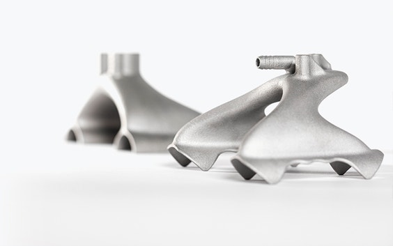 Two 3D-printed metal grippers with a design optimized for 3D printing