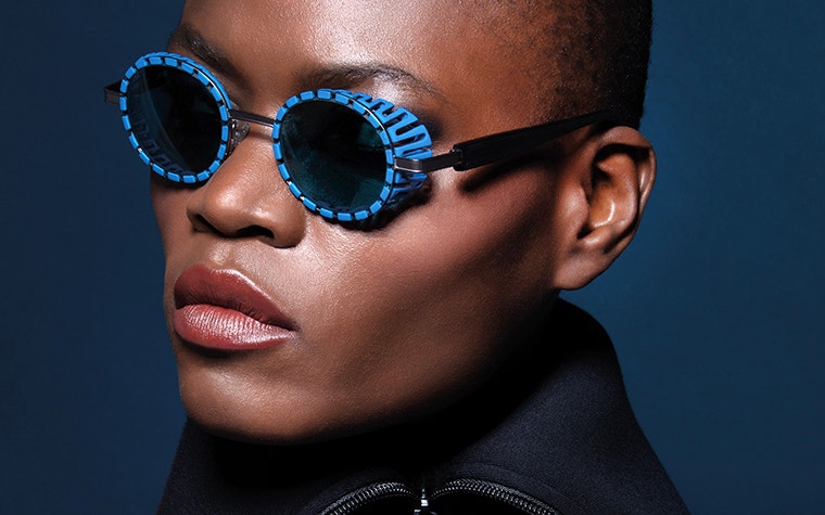 Close-up of model wearing blue JF Rey 3D-printed frames