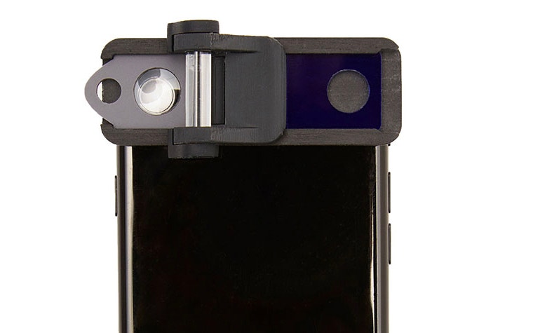 	An image of the OUI Inc. Smart Eye Camera attached to a smartphone