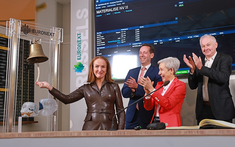 Materialise's Director of Corporate Affairs Carla Van Steenbergen rings the bell at Euronext Brussels while Materialise CEO Brigitte de Vet, CFO Koen Berges, and Founder Fried Vancraen look on clapping