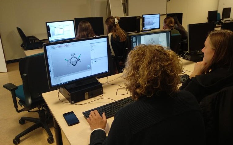 Students work with Mimics Innovation Suite software in front of a computer screen
