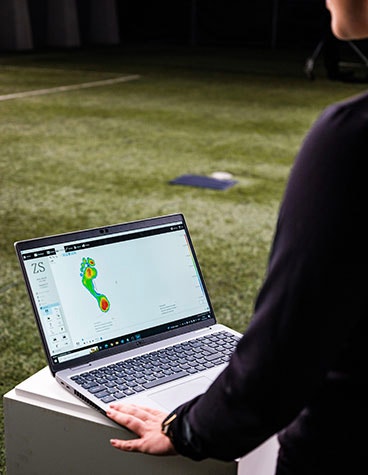 A computer showing the pressure points and forces underneath the foot during dynamic gait analysis