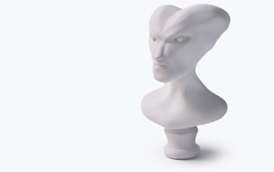 A white bust of an alien made in ABS using fused deposition modeling.