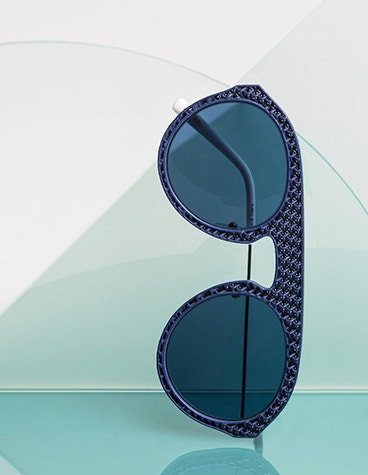 Sunglasses from the Safilo Oxydo eyewear collection on their side