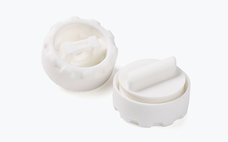 White 3D-printed biocompatible components made for Sartorius in PA 12 using SLS.