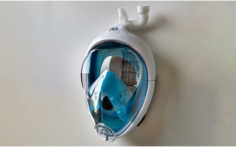 Ventilator mask hanging on a wall