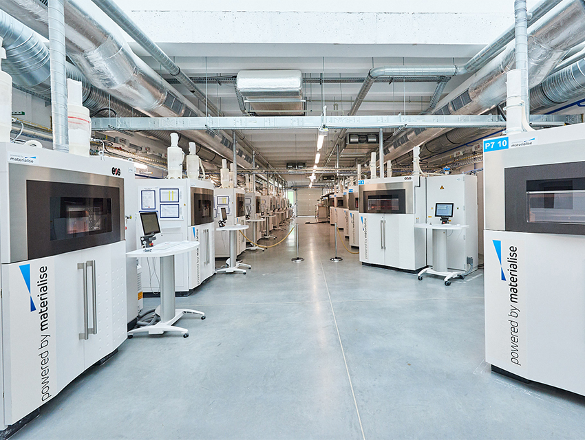 Rows of 3D printers in a Materialise production facility