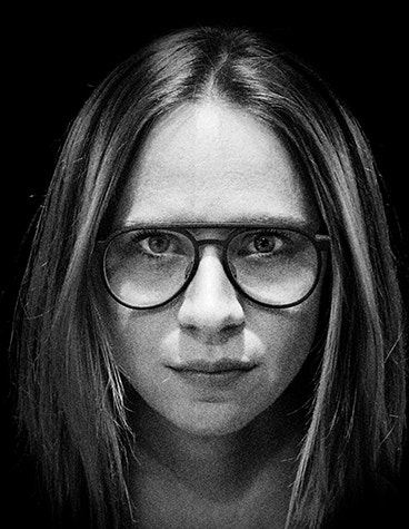 Grey-scale, extreme close-up image of female model wearing fmhofmann eyewear