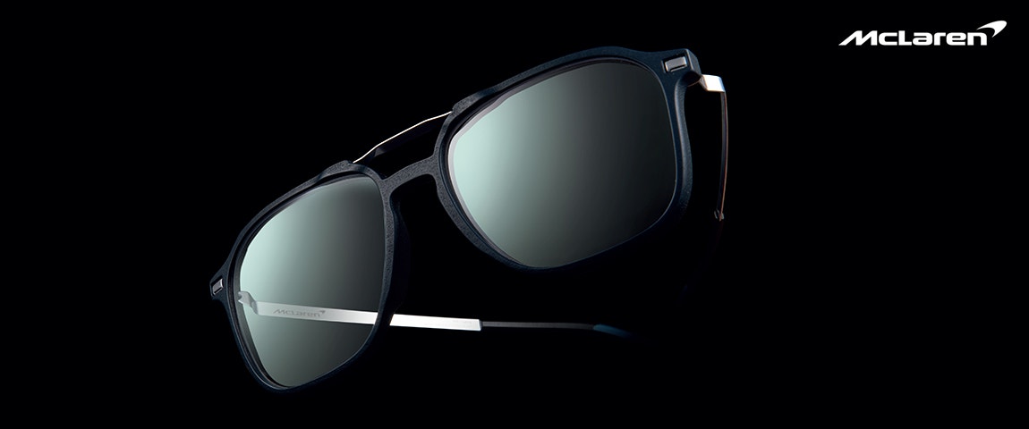 McLaren Vision Openmatic eyeglasses on a black background