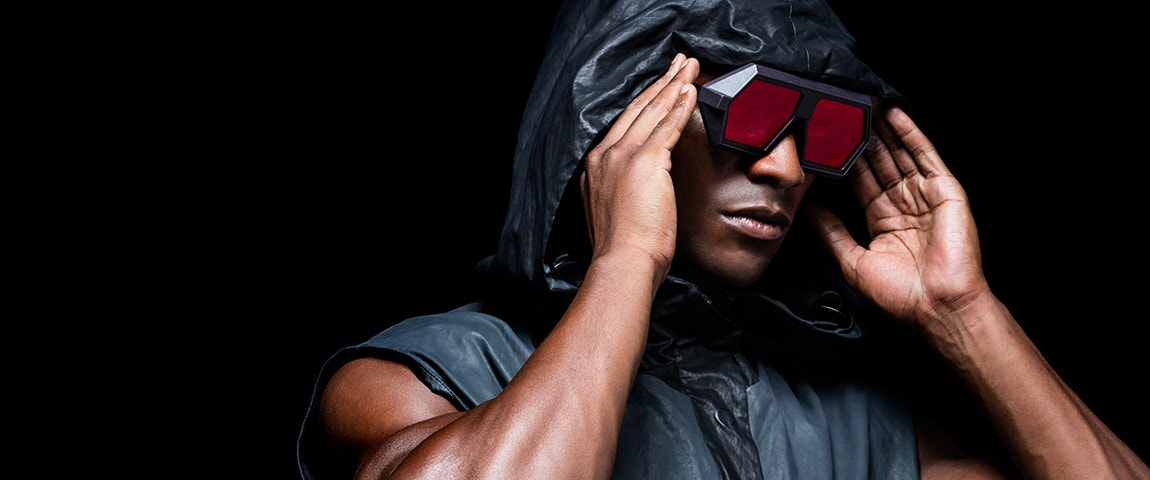 Black male model holding Vava Red Label sunglasses on his face