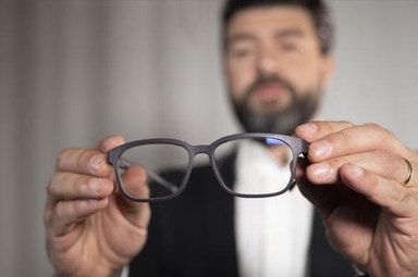 Alireza holding eyeglasses