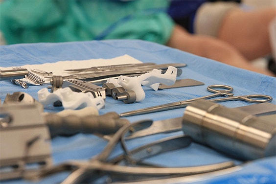 Personalized knee guides and medical instruments laid out for surgery