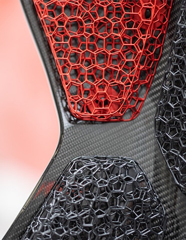 Close up of a car seat that uses a 3D-printed lattice structure