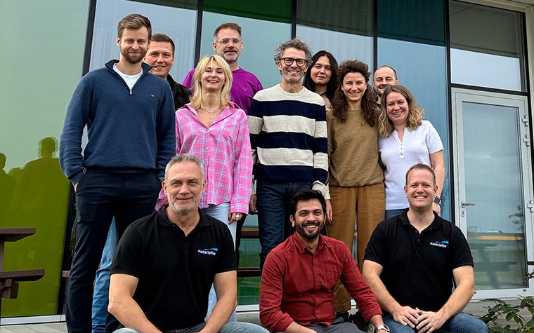 A large group of people standing outside of a Materialise office in Germany