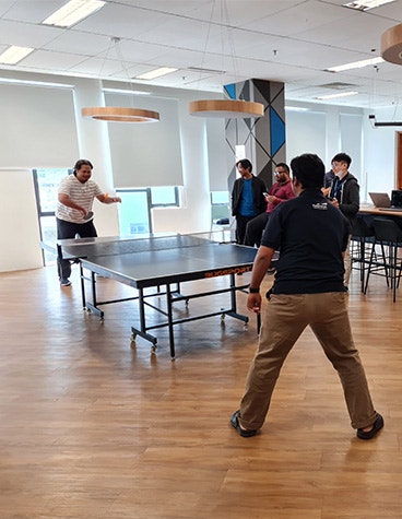 Materialise Malaysia team playing ping pong