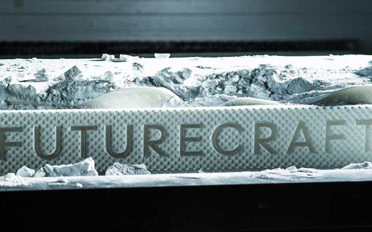 3D-printed sign that says Futurecraft in a powder bed