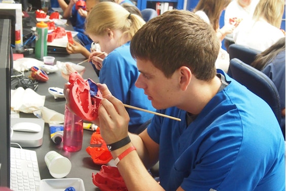 Student painting the inside of the heart 