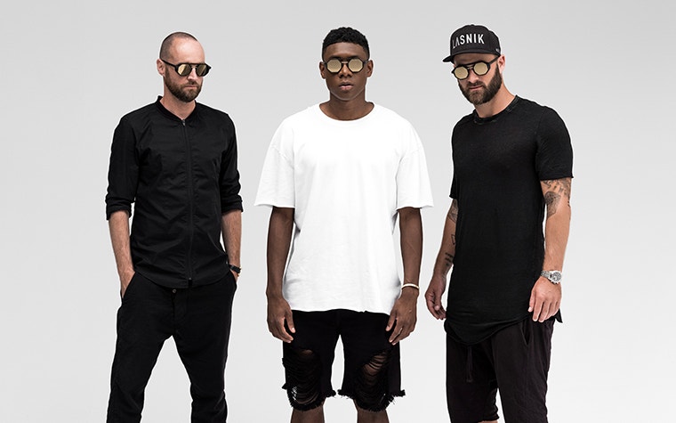 Three male models posing while wearing DA27 x Lasnik sunglasses