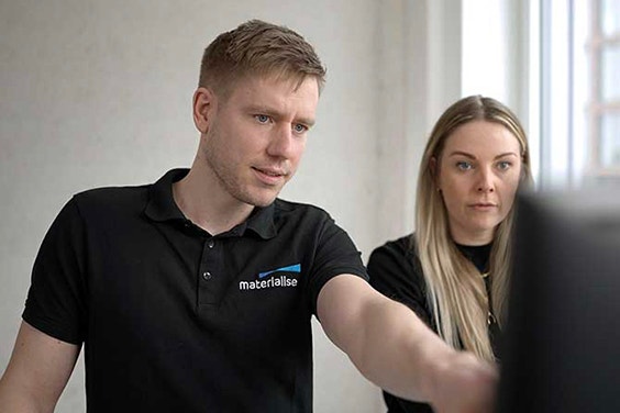 Two Materialise employees standing side by side