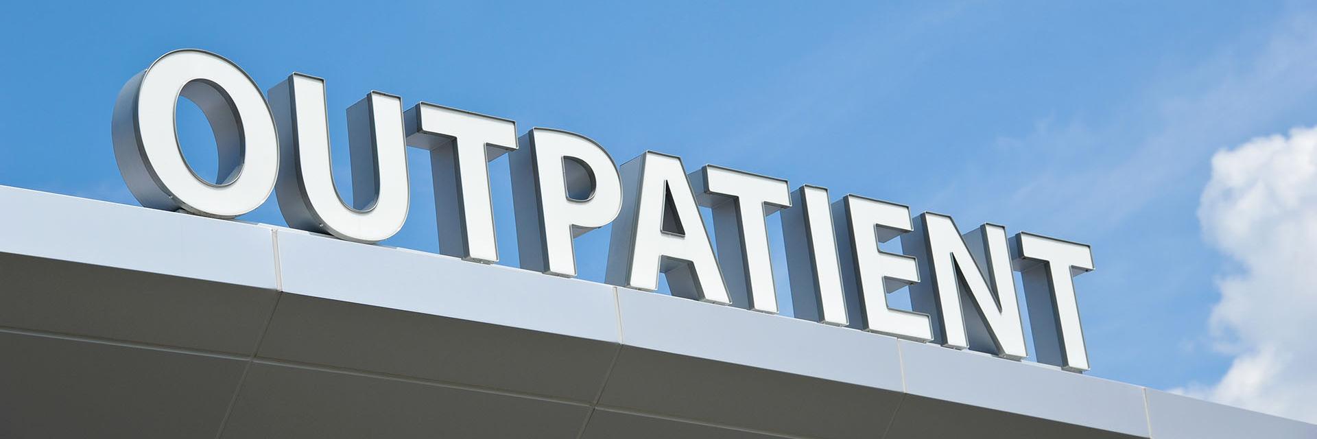 Outpatient sign on a building
