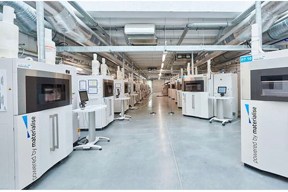 Rows of 3D printers in a Materialise production facility