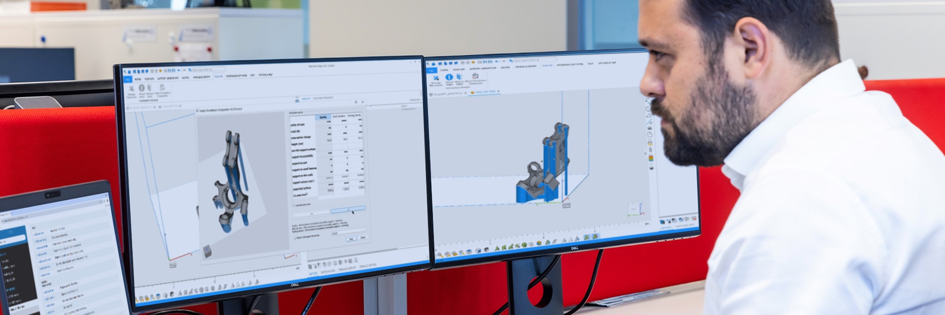 A man looking at two monitors and a laptop screen with the Magics SDK software displayed.