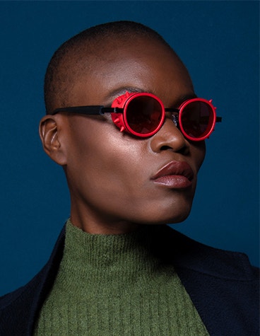 Close-up of model wearing red JF Rey 3D-printed frames 