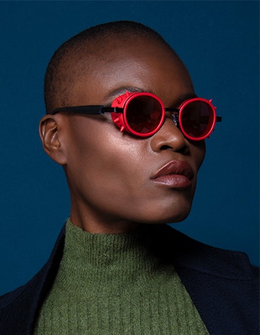 Close-up of model wearing red JF Rey 3D-printed frames