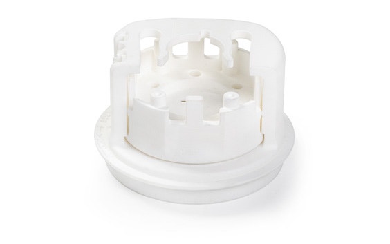 A white 3D-printed tool made in PA 12 Medical-Grade using selective laser sintering.