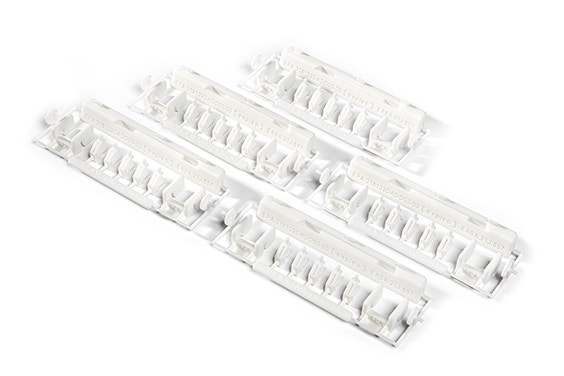 A series of 3D-printed repair kits with EASA 21.J quality labels. The kit contains small white plastic parts made of flame-retardant polyamide, designed by Expleo. These parts are used to replace commonly broken latches on Boeing 737 dado panels. 