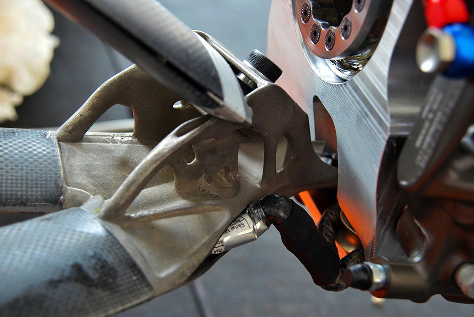 Close-up of 3D-printed metal wishbone on race car 