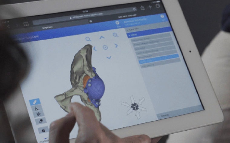 Person using medical software on a tablet
